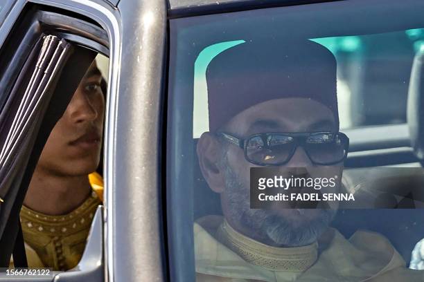 Convoy carrying Morocco's King Mohammed VI, accompanied by his son Crown Prince Moulay Hassan, leaves the Tetouan palace following a ceremony of...