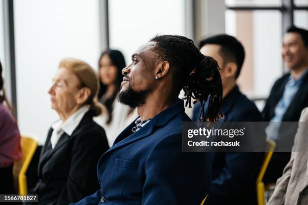 african american coworkers in meeting - succession planning stock pictures, royalty-free photos & images