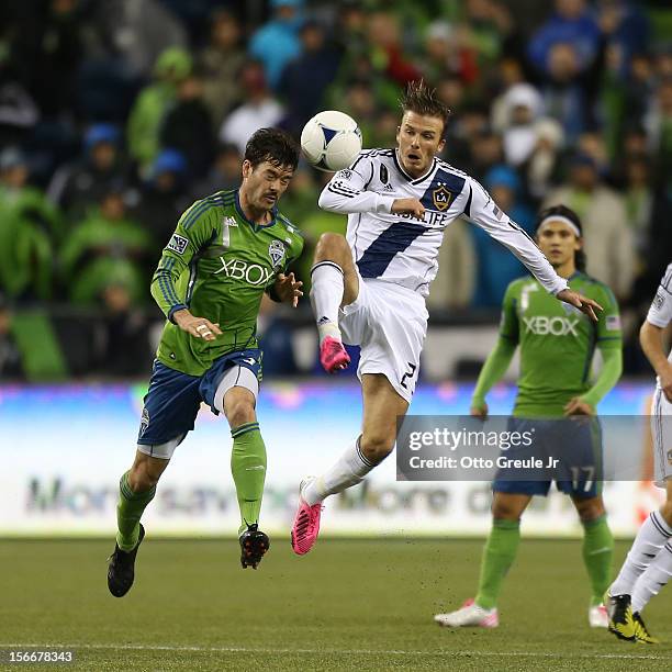 David Beckham of the Los Angeles Galaxy battles Brad Evans of the Seattle Sounders FC during Leg 2 of the Western Conference Championship at...