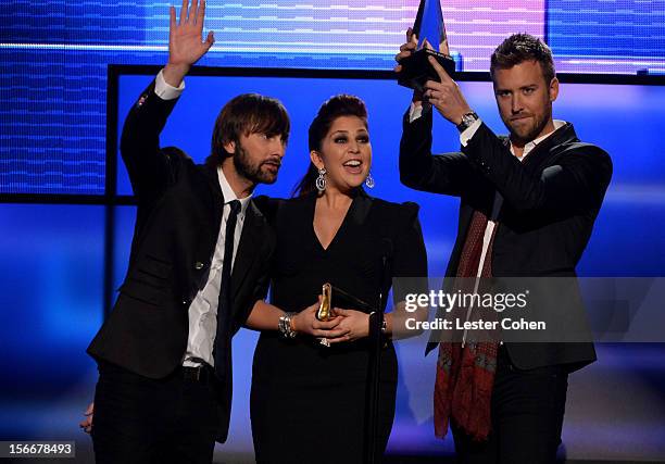 Musicians Dave Haywood, Hillary Scott and Charles Kelley of Lady Antebellum speak onstage during the 40th Anniversary American Music Awards held at...