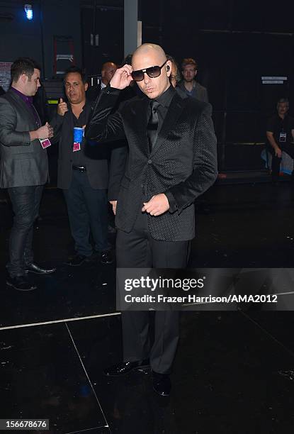 Singer Pitbull poses backstage at the 40th American Music Awards held at Nokia Theatre L.A. Live on November 18, 2012 in Los Angeles, California.
