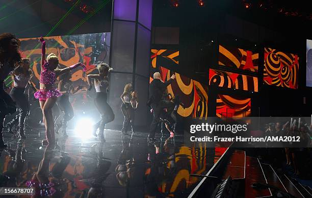 Singer Pitbull performs onstage at the 40th American Music Awards held at Nokia Theatre L.A. Live on November 18, 2012 in Los Angeles, California.