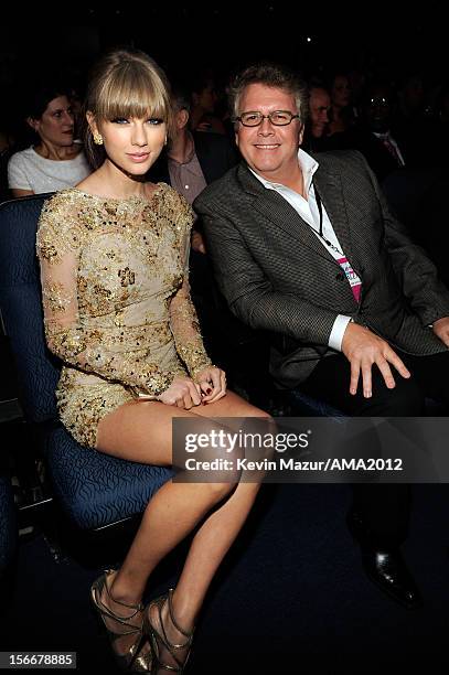Singer Taylor Swift and guest pose in the audience at the 40th American Music Awards held at Nokia Theatre L.A. Live on November 18, 2012 in Los...