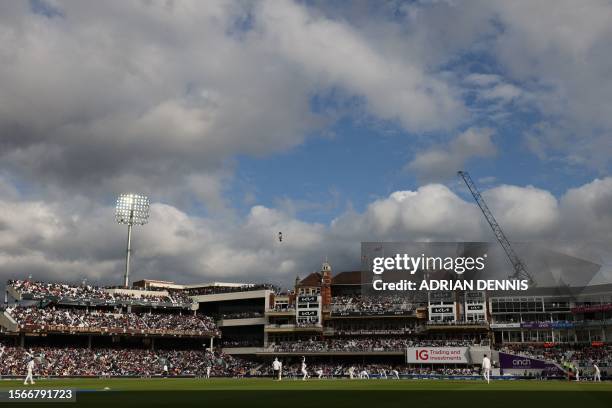 England's Moeen Ali bowls to Australia's wicket keeper Alex Carey on day five of the fifth Ashes cricket Test match between England and Australia at...