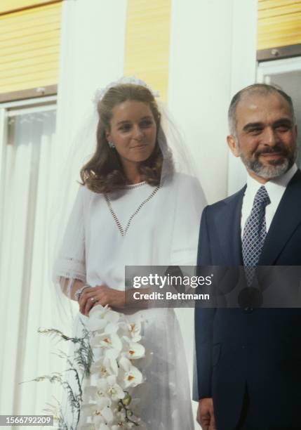 King Hussein of Jordan and his American bride Elizabeth Halaby are pictured after their wedding ceremony in Amman, Jordan, June 17th 1978....