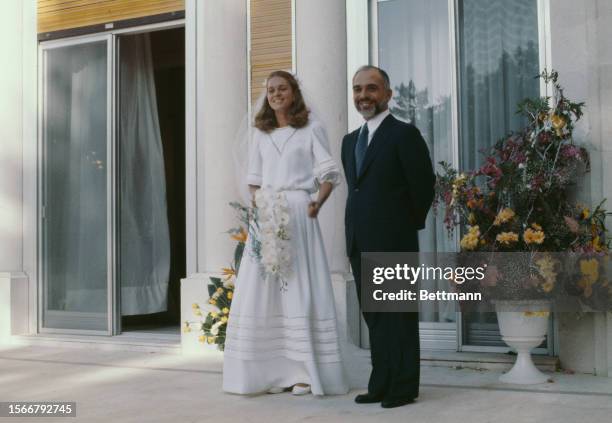 King Hussein of Jordan and his American bride Elizabeth Halaby are pictured after their wedding ceremony in Amman, Jordan, June 17th 1978....