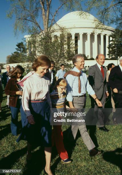 President Jimmy Carter, First Lady Rosalynn Carter and their daughter Amy walking near the Jefferson Memorial in Washington, April 12th 1978.