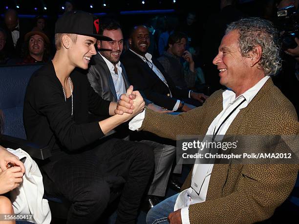 Singer Justin Bieber and producerof the American Music Awards Larry Klein at the 40th American Music Awards held at Nokia Theatre L.A. Live on...