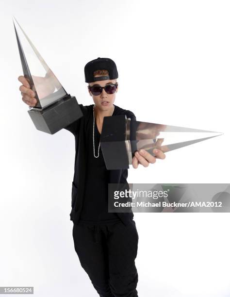 Singer Justin Bieber, winner of 3 AMA Awards poses for a portrait at the 40th American Music Awards Getty Images Wonderwall.com Portrait Studio held...