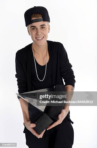 Singer Justin Bieber, winner of 3 AMA Awards poses for a portrait at the 40th American Music Awards Getty Images Wonderwall.com Portrait Studio held...