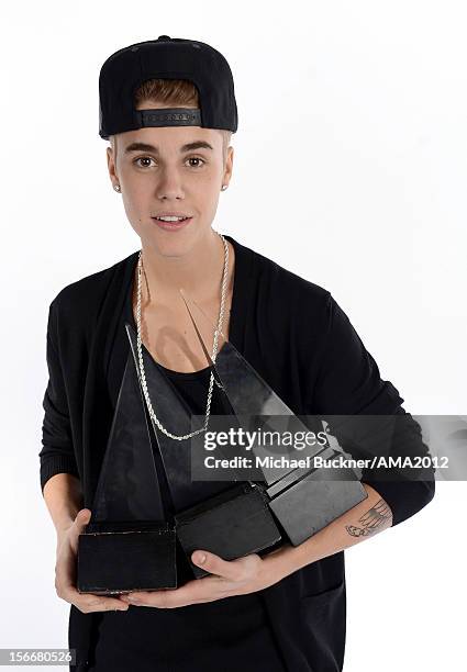 Singer Justin Bieber, winner of 3 AMA Awards poses for a portrait at the 40th American Music Awards Getty Images Wonderwall.com Portrait Studio held...