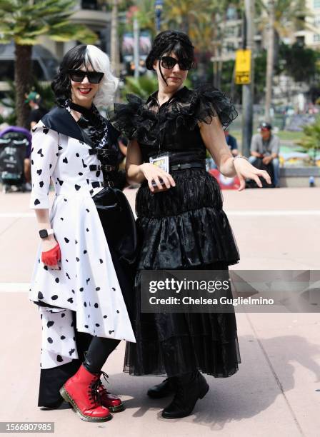 Cosplayers dressed as Wednesday Addams and Cruella de Vil pose during 2023 Comic-Con International: San Diego on July 23, 2023 in San Diego,...