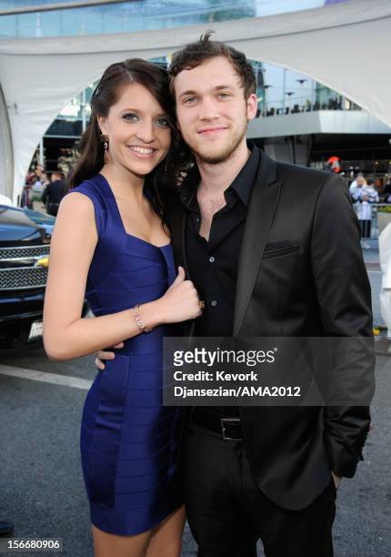 Musician Phillip Phillips and Hannah Blackwell attend the 40th American Music Awards held at Nokia Theatre L.A. Live on November 18, 2012 in Los...
