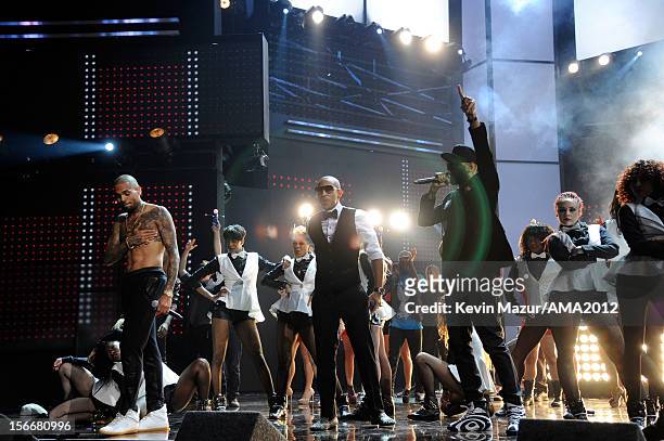 Singer Chris Brown and rappers Ludacris and Swizz Beatz perform onstage at the 40th American Music Awards held at Nokia Theatre L.A. Live on November...