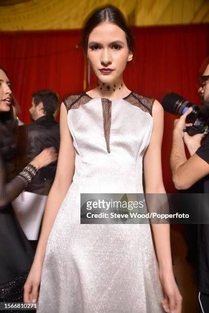 Backstage at Style Fashion Week, part of New York Fashion Week Autumn/Winter 2016/17, a model wears an A line dress in silver textured fabric by...