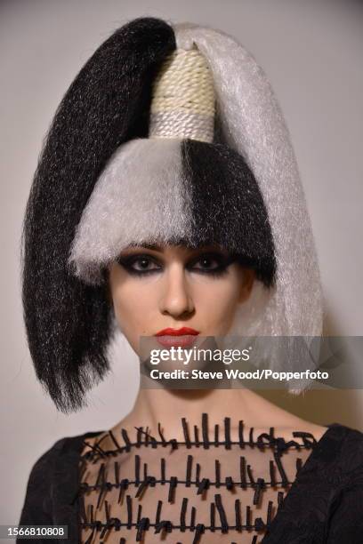 Backstage at Style Fashion Week, part of New York Fashion Week Autumn/Winter 2016/17, a model wears a black brocade dress with an embellished mesh...