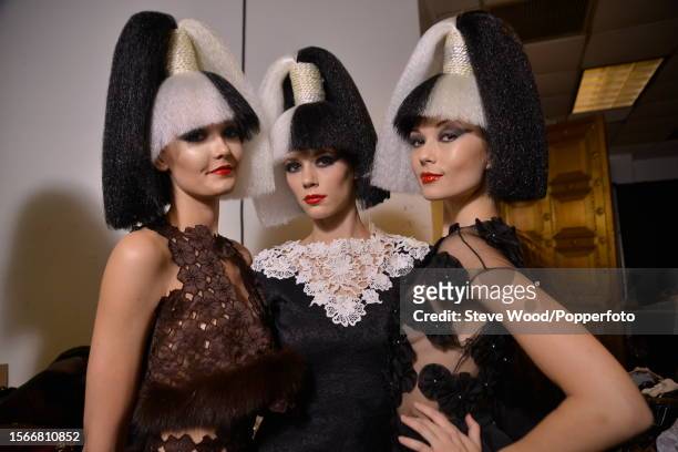 Backstage at Style Fashion Week, part of New York Fashion Week Autumn/Winter 2016/17, three models wear garments by designer Nina Gleyzer, one is a...