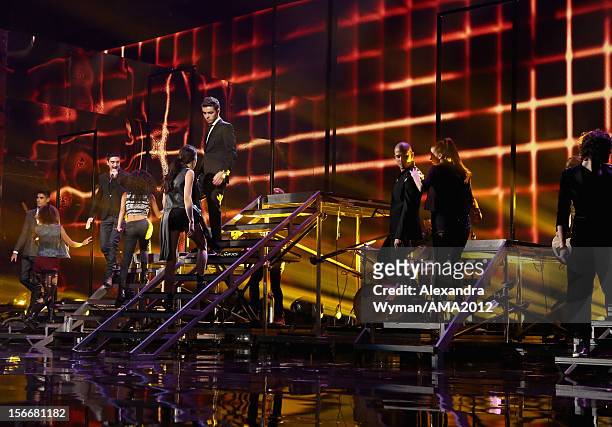 Siva Kaneswaran, Tom Parker, Nathan Sykes, Max George, and Jay McGuiness of The Wanted perform onstage at the 40th American Music Awards held at...