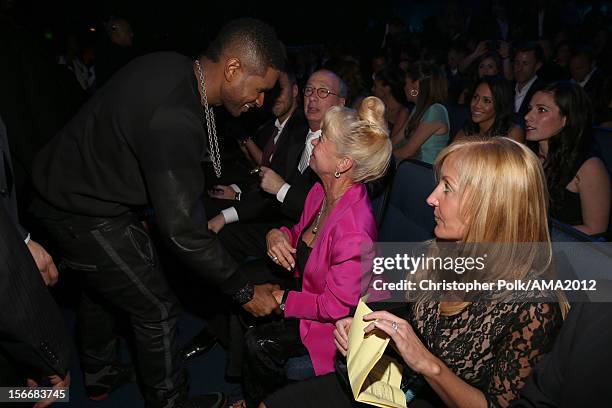 Singer Usher and Kari Clark at the 40th American Music Awards held at Nokia Theatre L.A. Live on November 18, 2012 in Los Angeles, California.