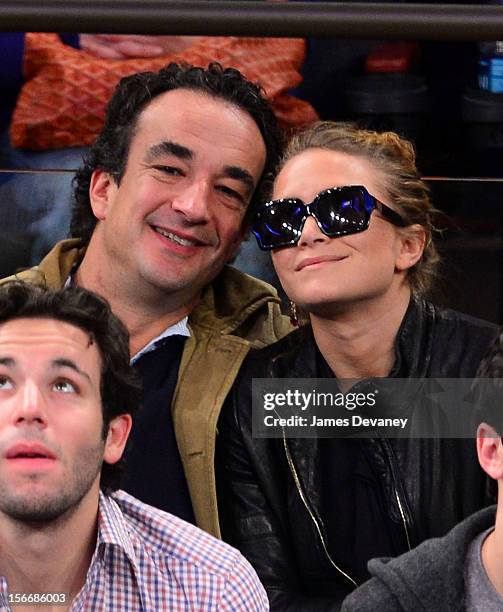 Olivier Sarkozy and Mary-Kate Olsen attend New York Knicks verse Indiana Pacers game at Madison Square Garden on November 18, 2012 in New York City.