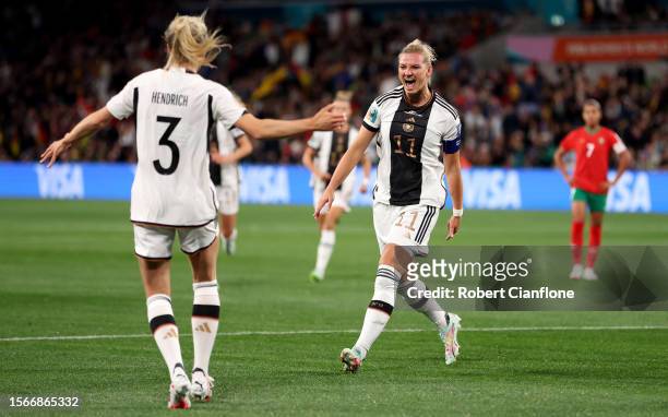 Alexandra Popp of Germany celebrates with teammate Kathrin Hendrich after scoring her team's first goal during the FIFA Women's World Cup Australia &...