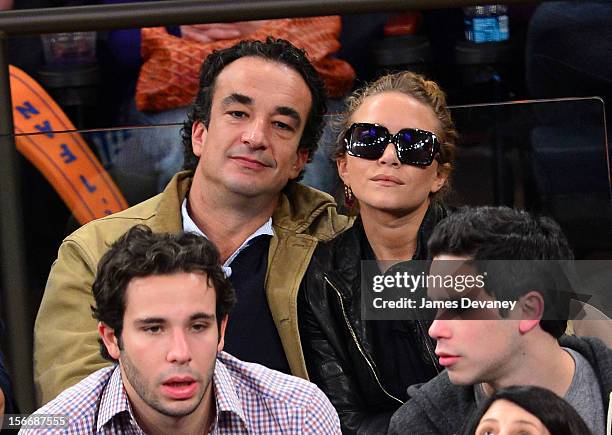 Olivier Sarkozy and Mary-Kate Olsen attend New York Knicks verse Indiana Pacers game at Madison Square Garden on November 18, 2012 in New York City.