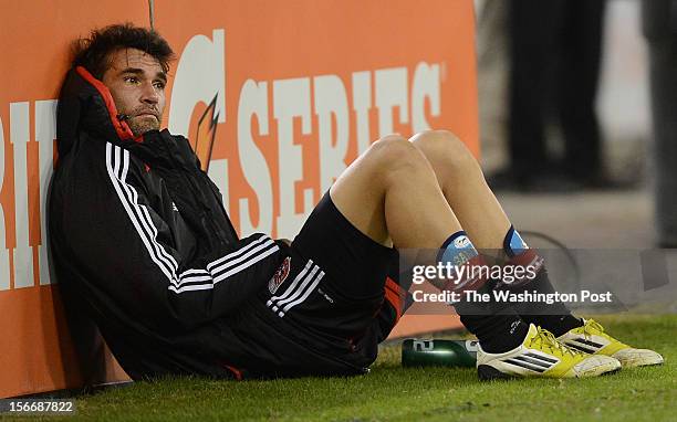 United defender Emiliano Dudar , left, watches the final minutes from the sidelines after being taken out of the second game of the Eastern...