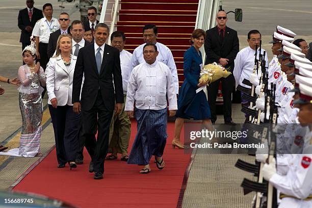 President Barack Obama alongside Secretary of State Hillary Clinton chat with Burmese Foreign minister Wunna Maung Lwin as they arrive at Yangon...