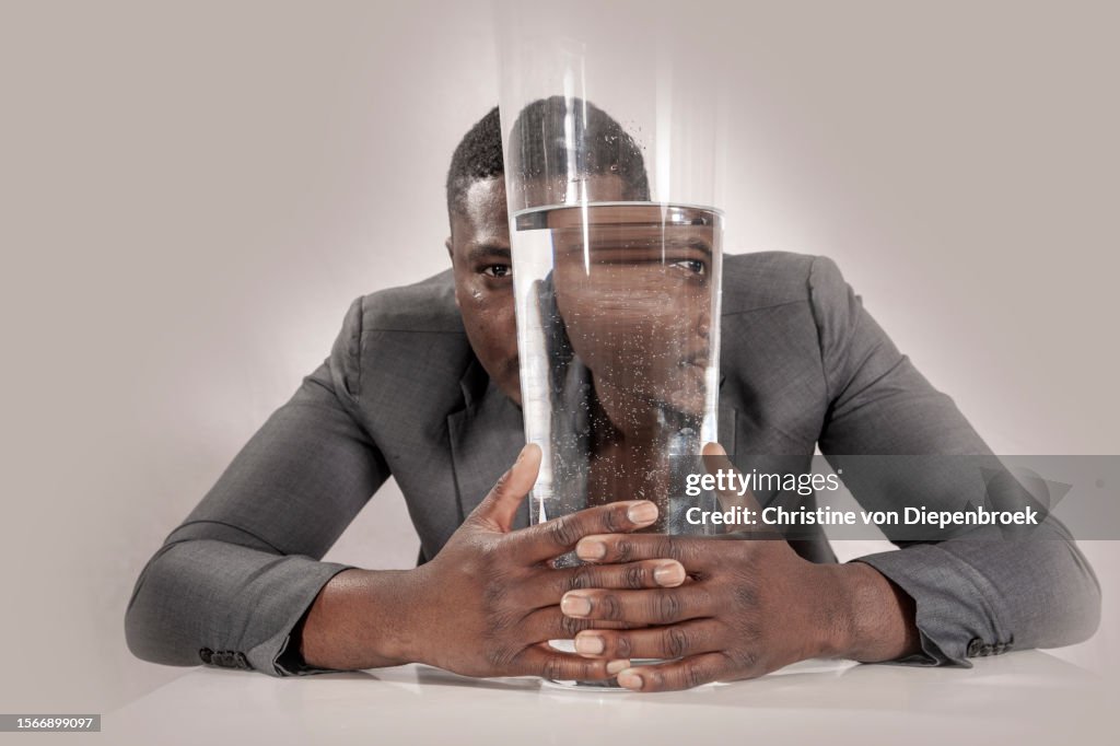 Young african man at table