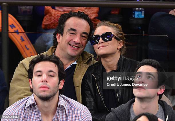 Olivier Sarkozy and Mary-Kate Olsen attend New York Knicks verse Indiana Pacers game at Madison Square Garden on November 18, 2012 in New York City.