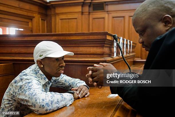 Xolile Mngeni , the man accused of killing Swedish honeymooner Anni Dewani, talks to his lawyer Qalisile Dayimani, at Cape Town's High Court on...