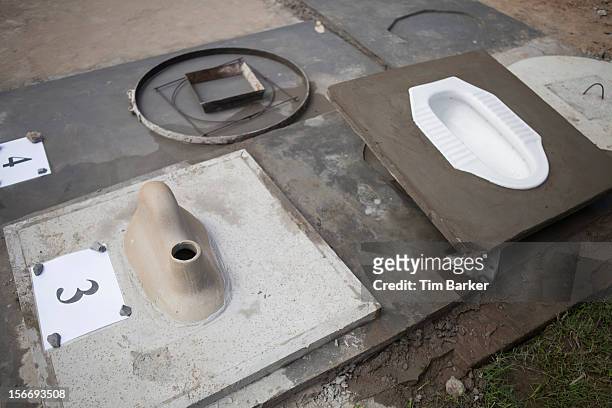 Toilets in production are displayed at the Toilet Production Center during a media briefing during World Toilet Day on November 19, 2012 in Vinh...