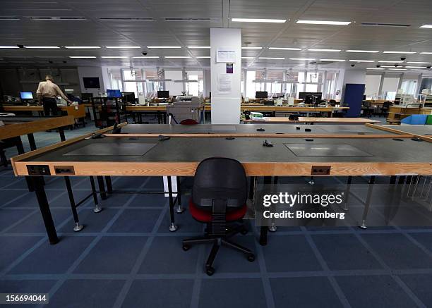 Empty chairs and sorting tables are seen in the diamond processing area at the De Beers office in London, U.K., on Friday, Nov. 16, 2012. De Beers,...