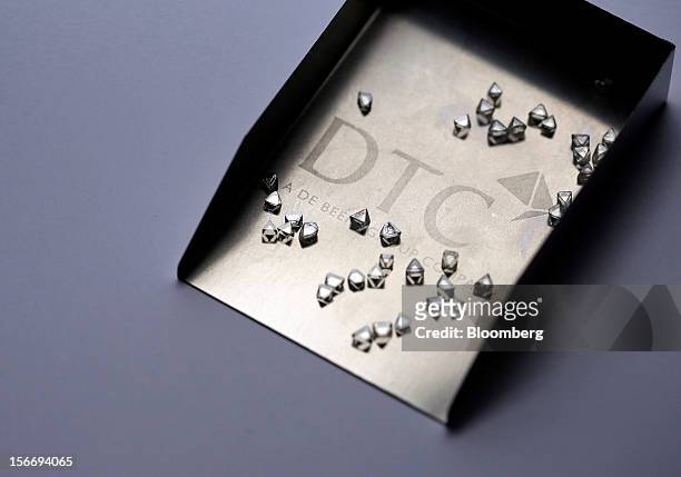 Uncut diamonds are seen in this arranged photograph at the De Beers office in London, U.K., on Friday, Nov. 16, 2012. De Beers, the biggest diamond...