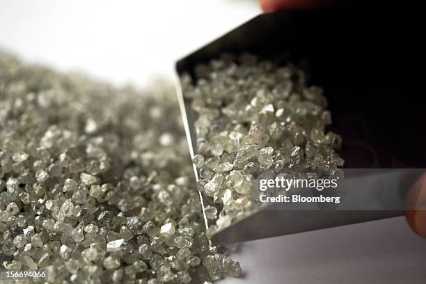 Uncut diamonds are seen in this arranged photograph at the De Beers office in London, U.K., on Friday, Nov. 16, 2012. De Beers, the biggest diamond...