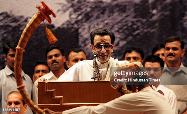 Shiv Sena Supremo Balasaheb Thackeray smiles at the traditional "Tutari" player welcome him on stage at Shanmukhanand Hall on September 2, 2005 in...