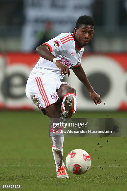 David Alaba of Muenchen runs with the ball during the Bundesliga match between 1. FC Nuernberg and FC Bayern Muenchen at Easy Credit Stadium on...