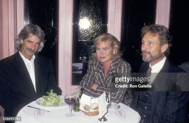 Actor Sam Elliott, actress Margaux Hemiingway and actor John Phillip Law on October 19, 1987 dine at Cafe Reginette in New York City.