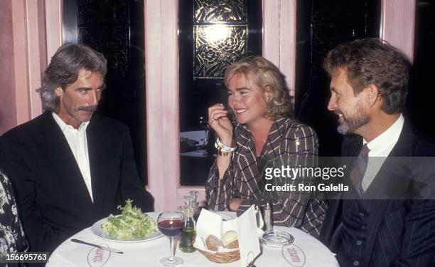 Actor Sam Elliott, actress Margaux Hemiingway and actor John Phillip Law on October 19, 1987 dine at Cafe Reginette in New York City.