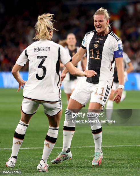 Alexandra Popp of Germany celebrates with teammate Kathrin Hendrich after scoring her team's first goal during the FIFA Women's World Cup Australia &...