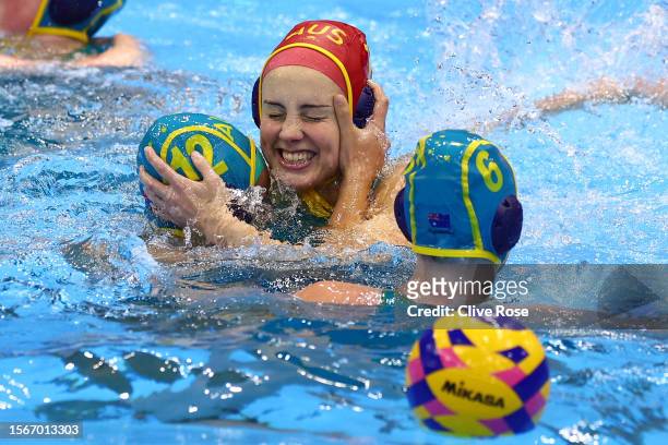 Gabriella Palm of Team Australia celebrates with team mates after making a save in the Women's Water Polo Quarterfinal match between Team Greece and...