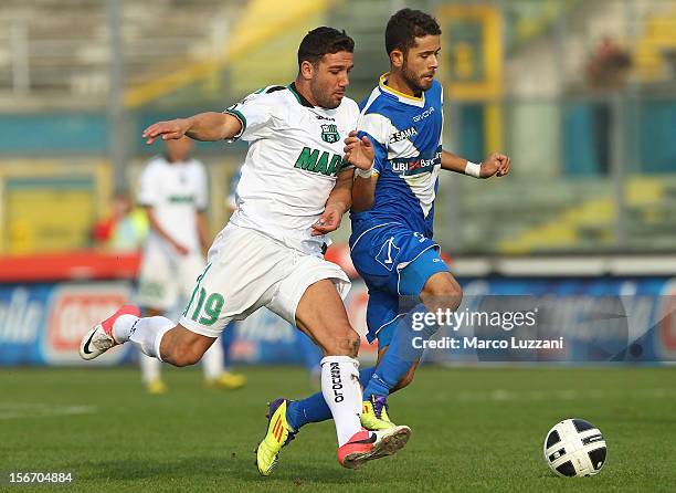 Vitor Rodrigues Mata of Brescia Calcio competes for the ball with Gennaro Trianiello of US Sassuolo during the Serie B match between Brescia Calcio...