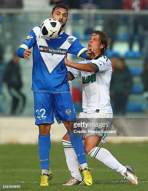 Daniele Corvia of Brescia Calcio competes for the ball with Marcello Gazzola of US Sassuolo during the Serie B match between Brescia Calcio and US...