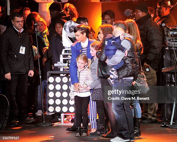 Singer Rihanna meets fans after switching on the Christmas lights at Westfield Stratford City with young ambassadors from Save The Children,...