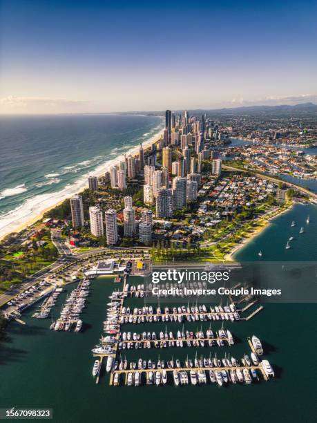 aerial view vertical scene of gold coast beach around main beach can see yacht club and all area of surfers paradise, broadbeach and with luxury hotel and apartment at gold coast, queensland,australia - main beach gold coast stock pictures, royalty-free photos & images