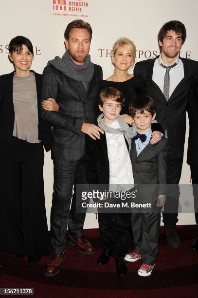 Actors Ewan McGregor, Naomi Watts, Samuel Joslin and Oaklee Pendergast pose with Spanish tsunami survivors Maria Belon and son Lucas Belon at the UK...