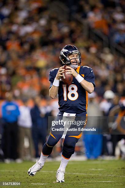Quarterback Peyton Manning of the Denver Broncos looks to pass against the San Diego Chargers at Sports Authority Field Field at Mile High on...