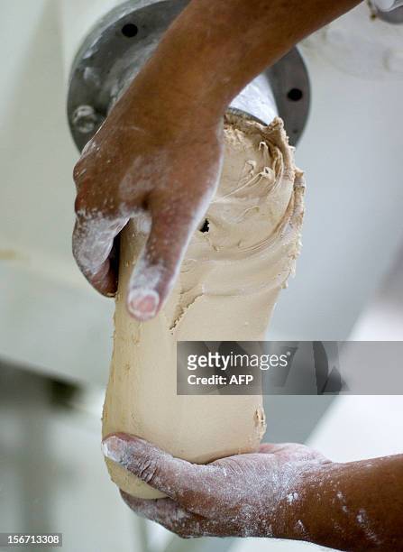 An employee works in the production line of the organic chewing gum at "Chicza" factory in Chetumal, Quintana Roo State, Mexico, on November 15,...