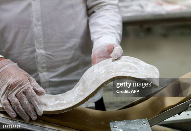 An employee works in the production line of the organic chewing gum at "Chicza" factory in Chetumal, Quintana Roo State, Mexico, on November 15,...