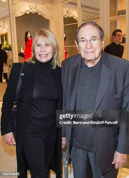 Robert Hossein and Candice Patou attend the signing of Francis Huster's book "And Dior Created Woman" at Dior Boutique on November 19, 2012 in Paris,...